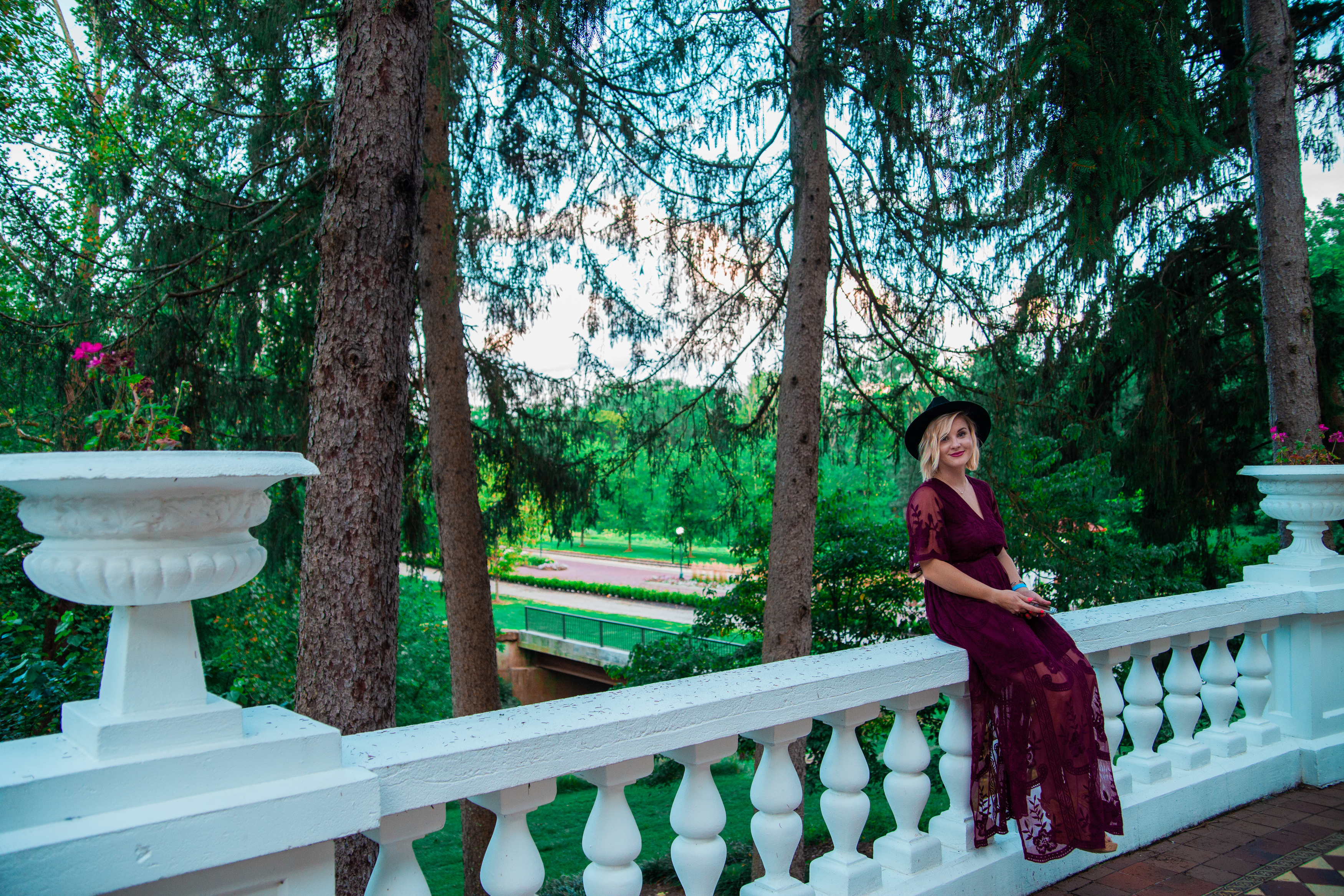 a woman sitting on a railing