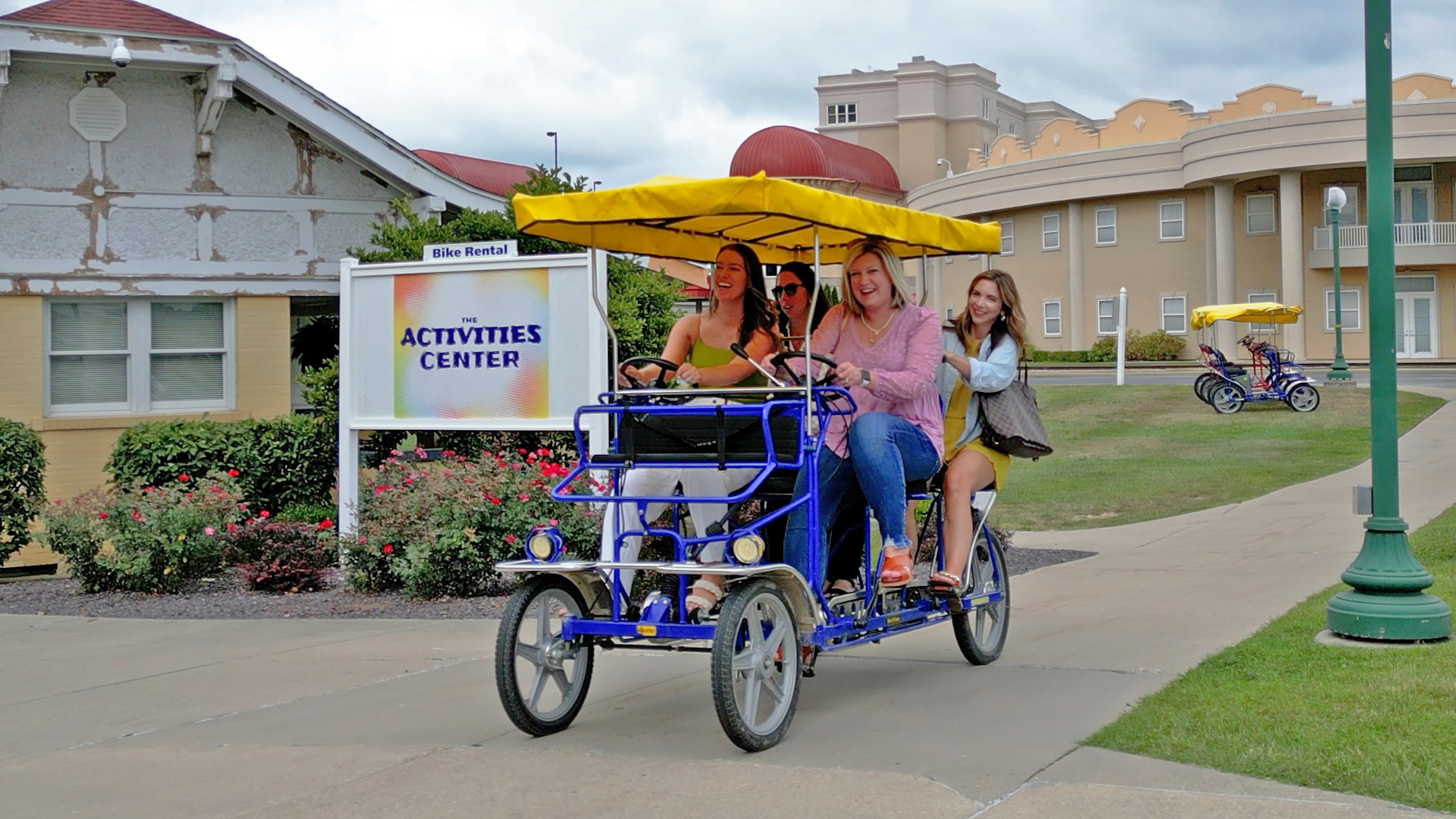 a group of women riding a bicycle