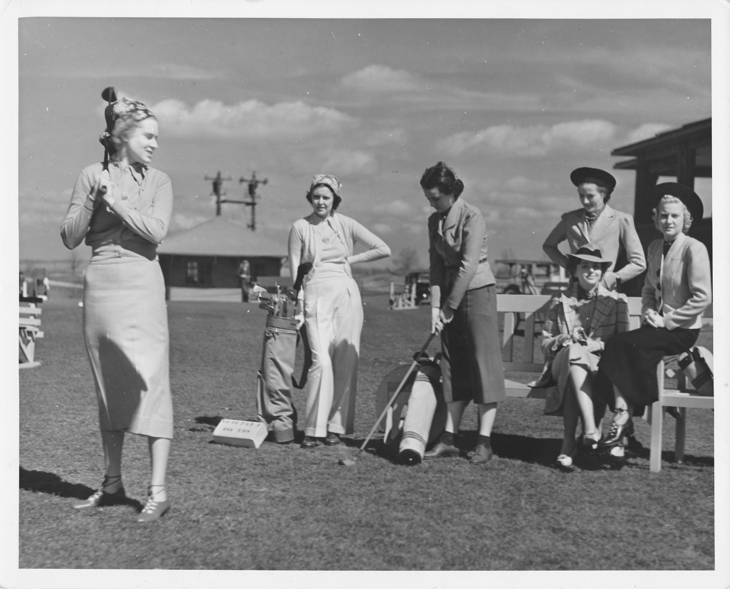 a group of women playing golf