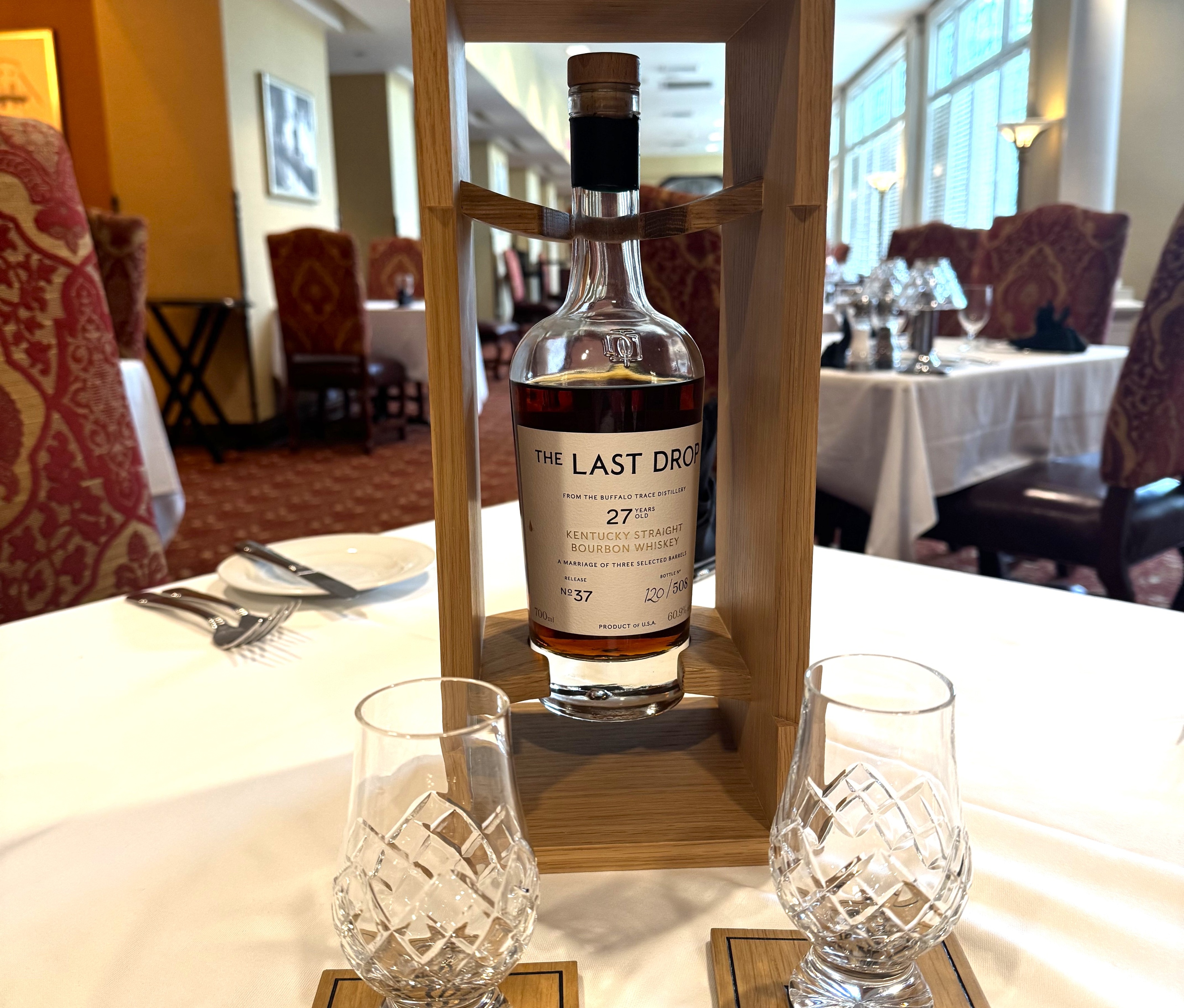 A bottle of bourbon on a restaurant table