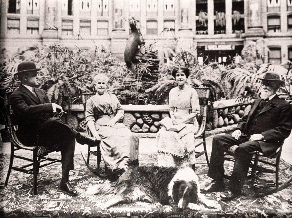 A group of people sitting by a fountain