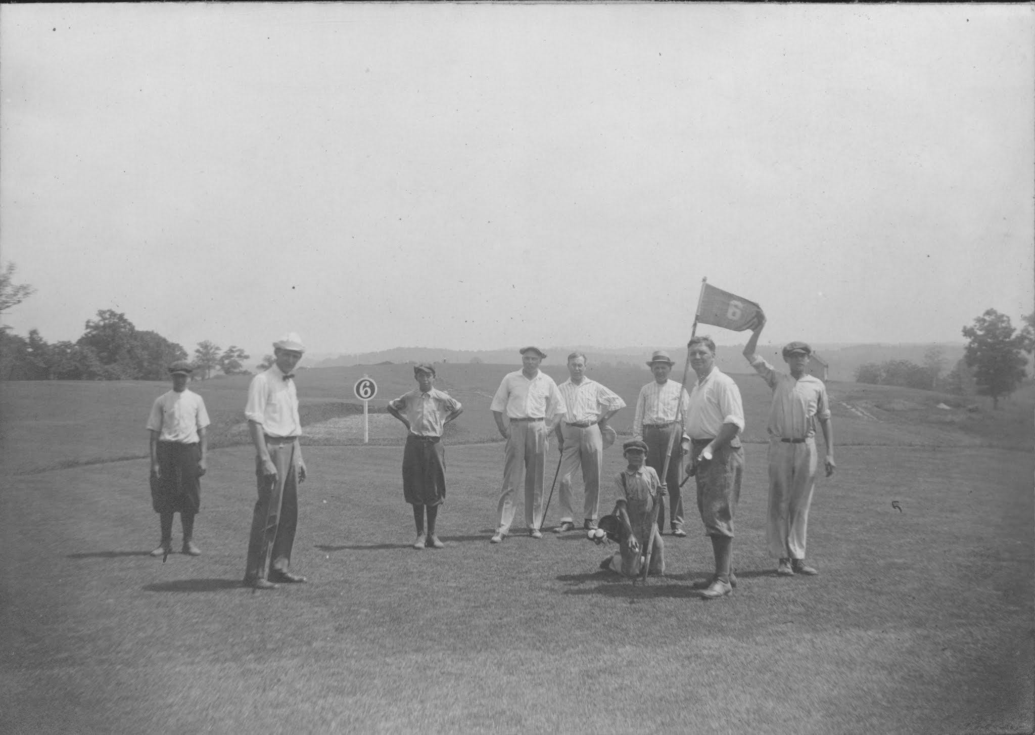 a group of men on a golf course
