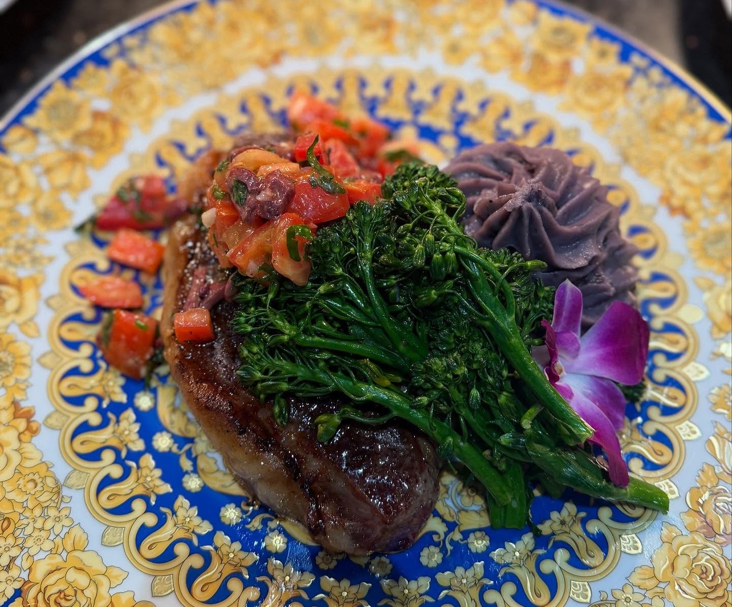 a plate of food with flowers and vegetables