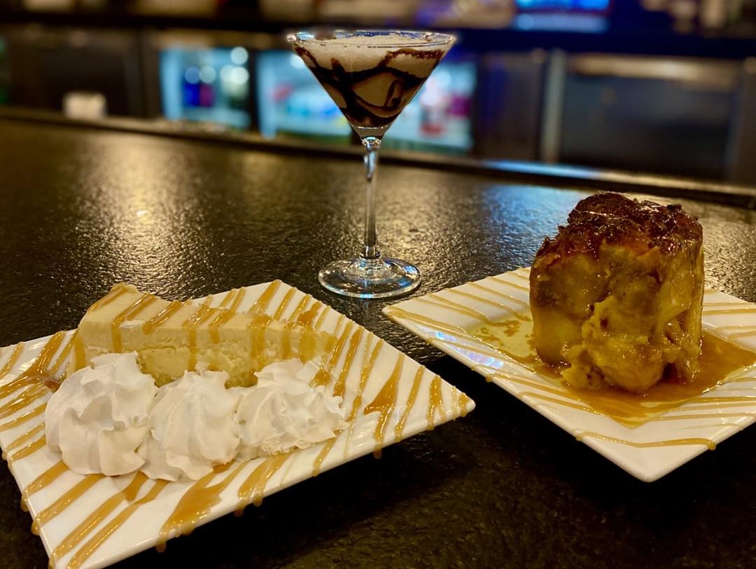a plate of dessert and a martini glass