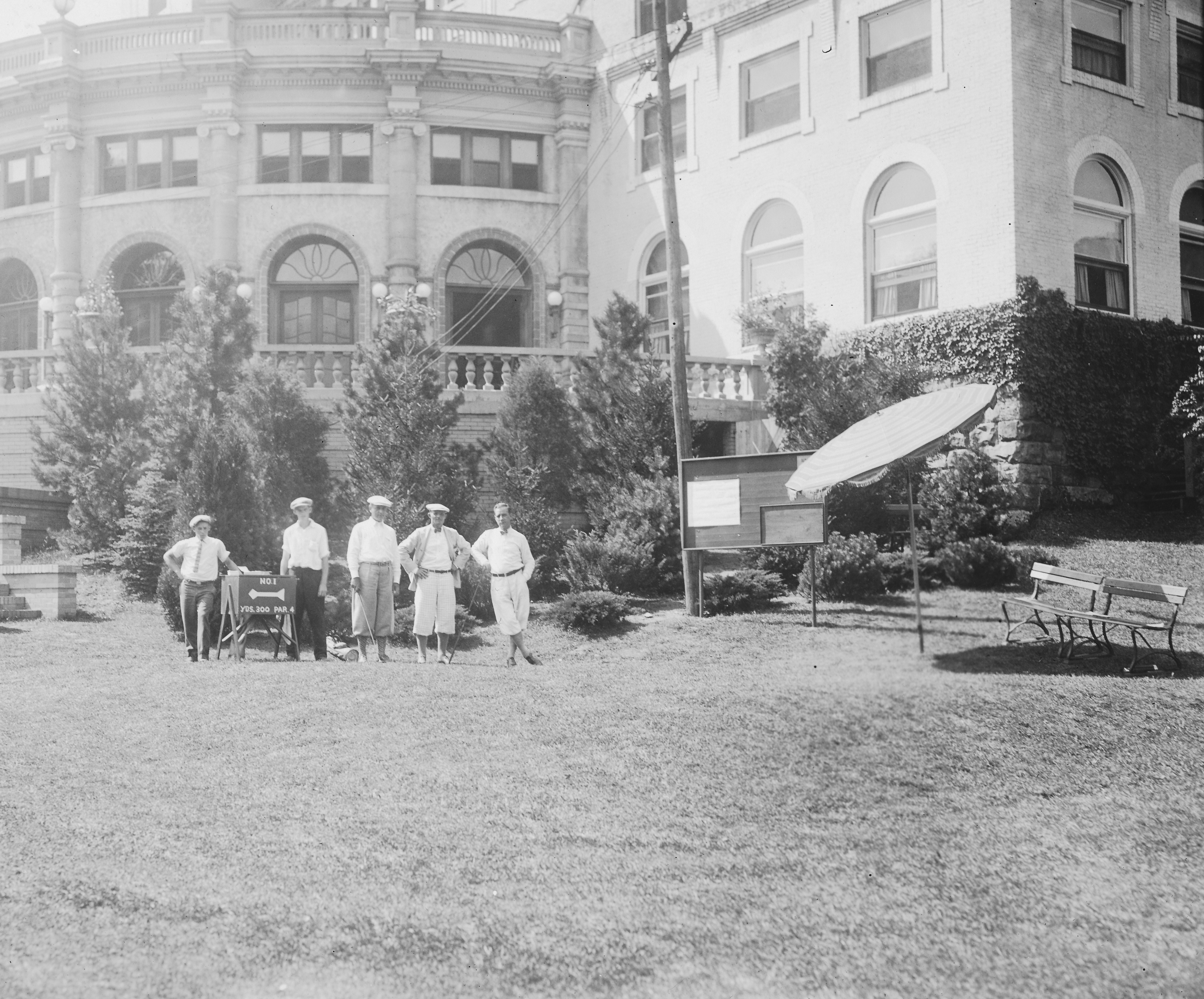 a group of people standing in front of a building
