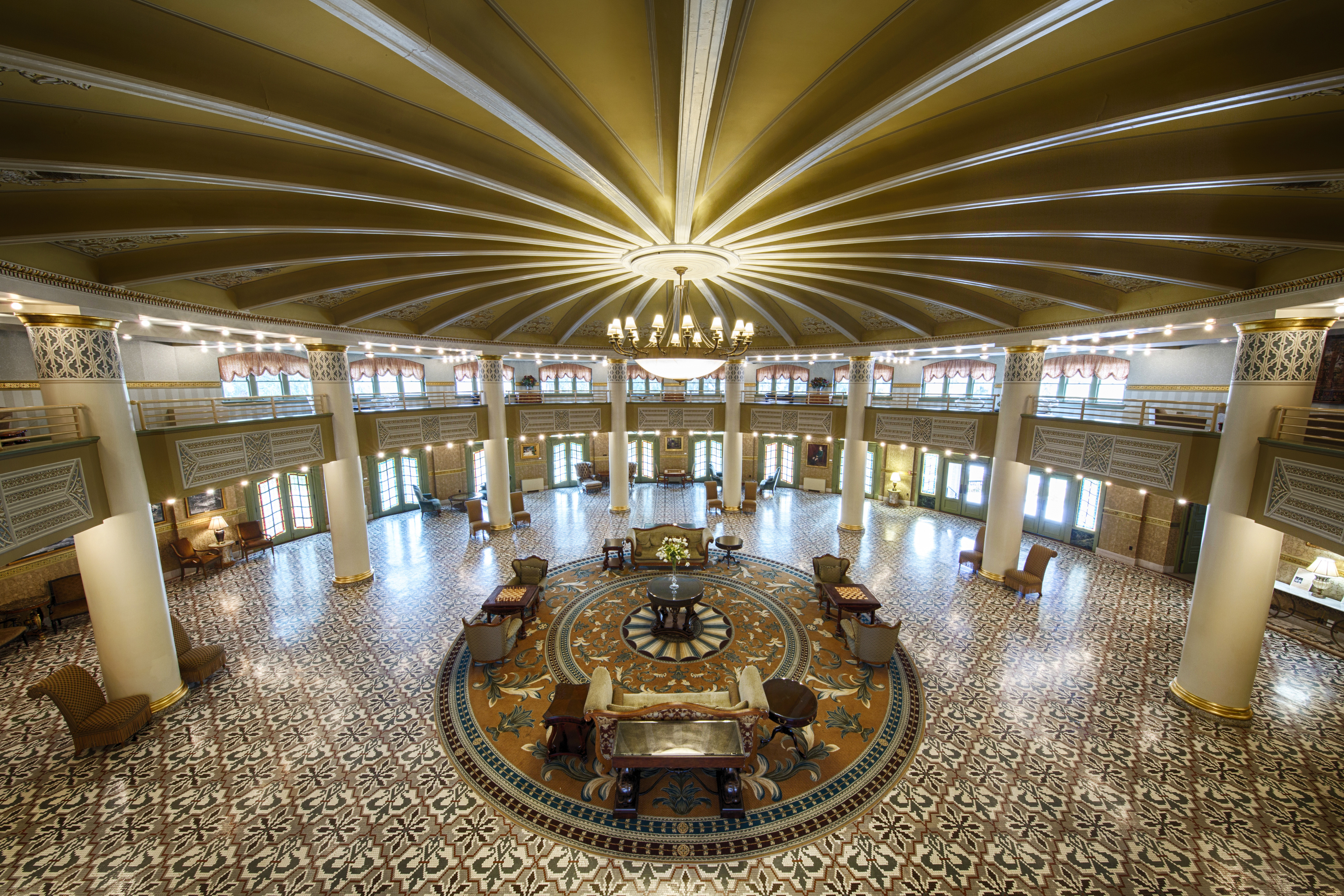 a large room with a circular floor and a chandelier