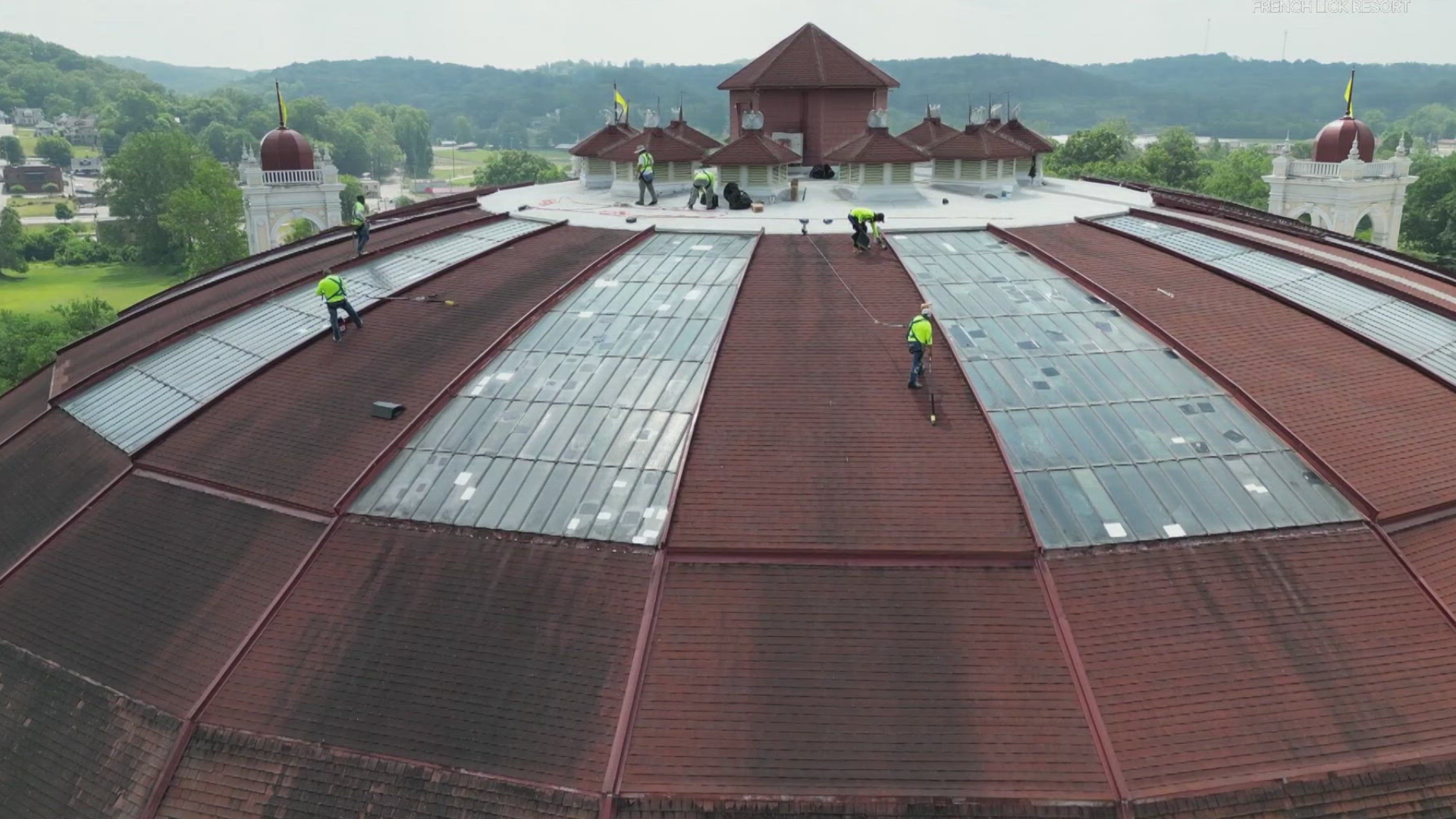 a group of men cleaning a roof