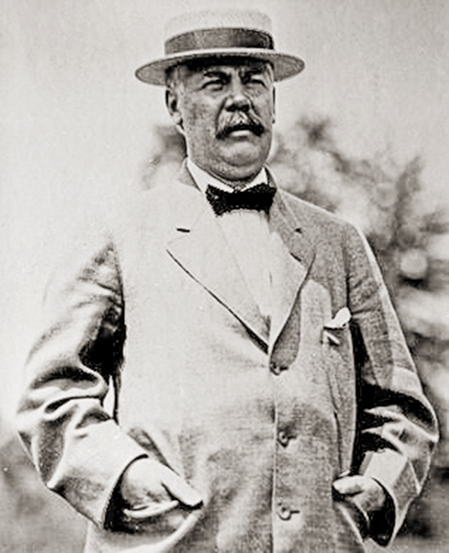 a man in a suit and hat