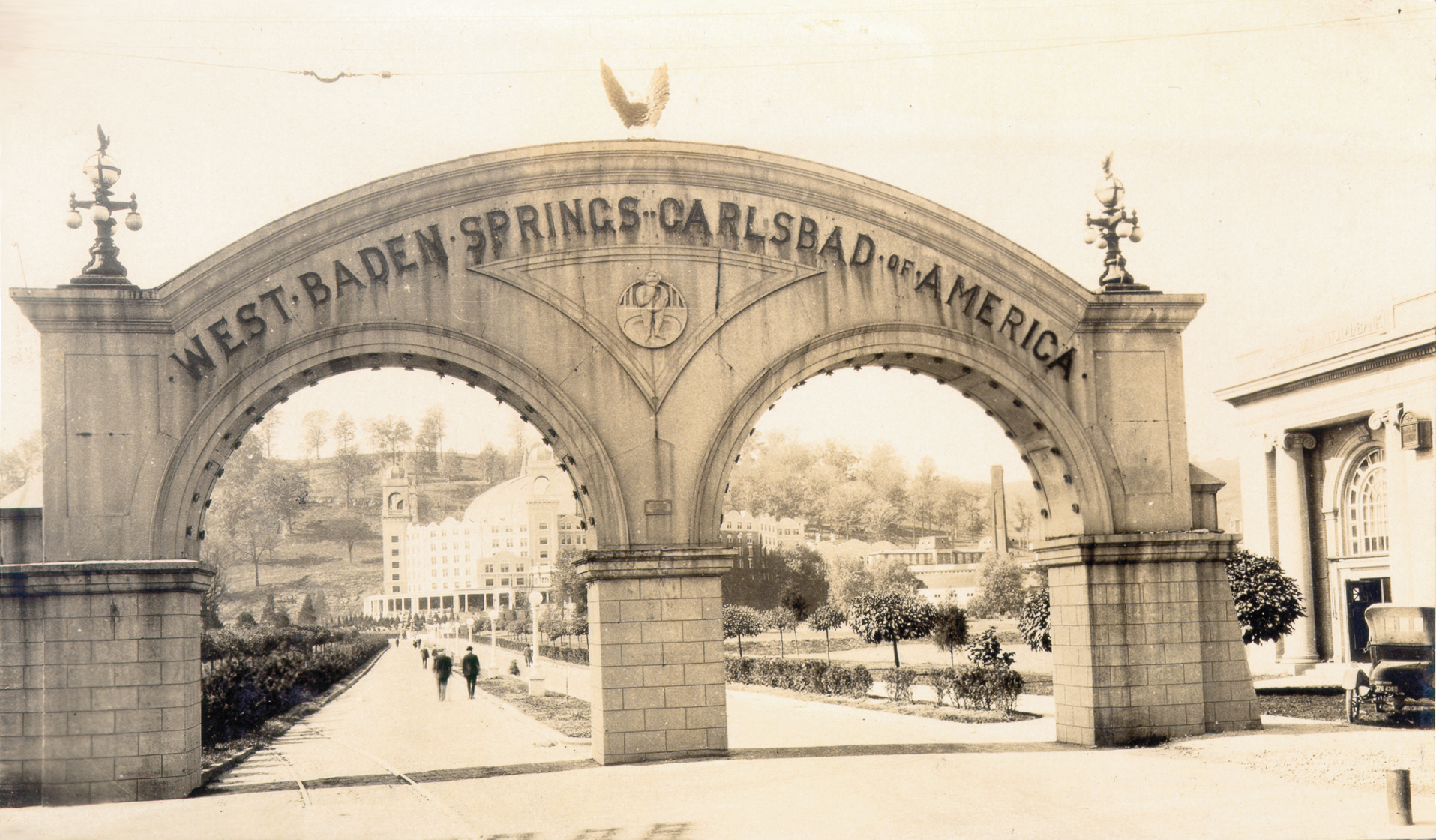 a stone arch with a sign on it