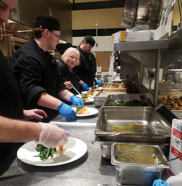 Line Cooks making dinner plates