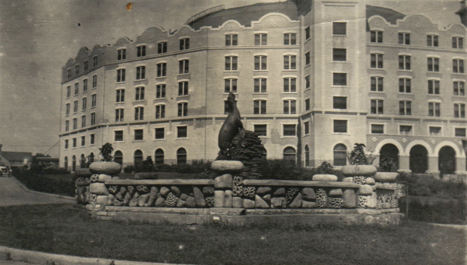a statue in front of a building