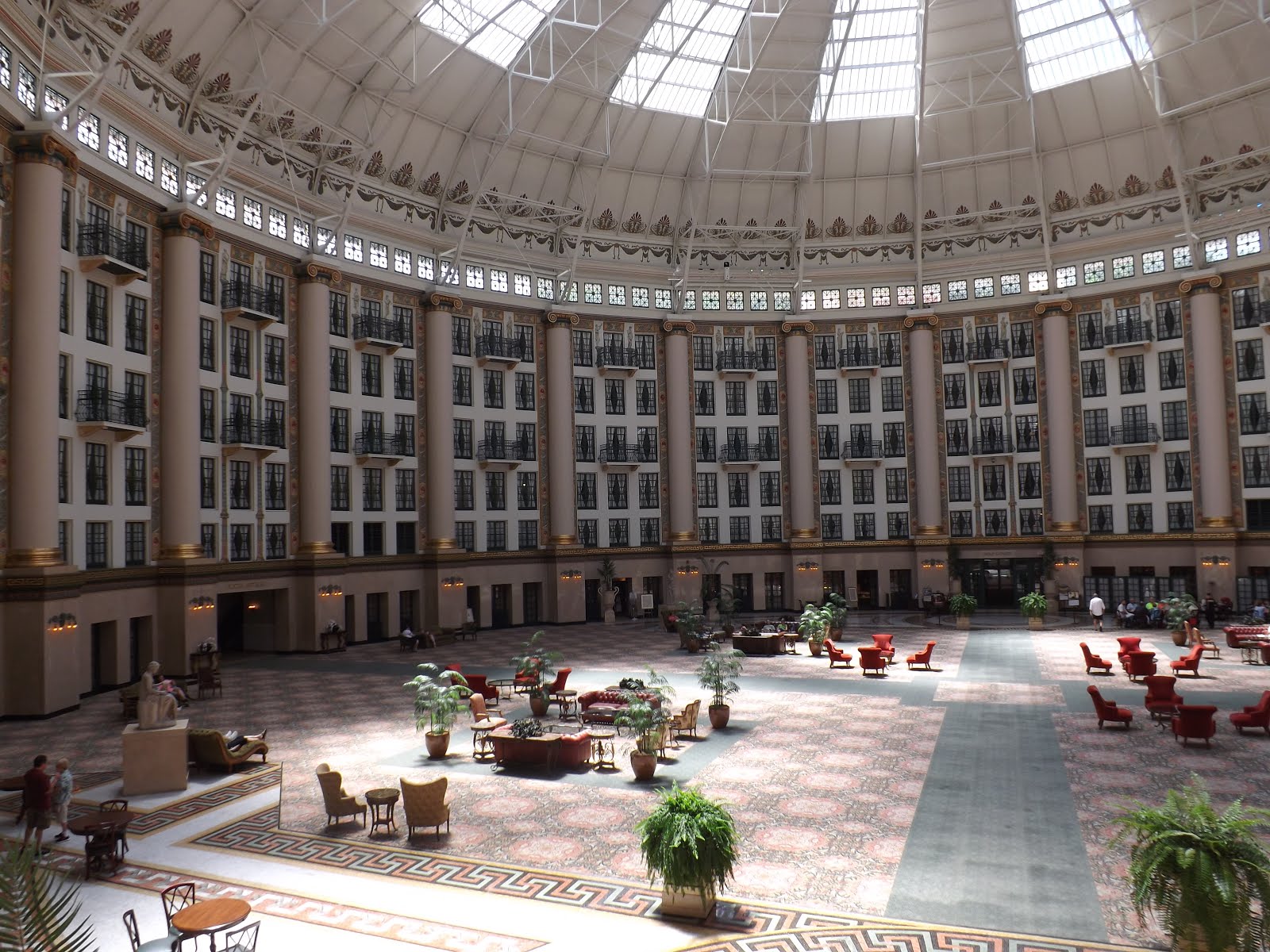 a large circular building with many windows and a large floor